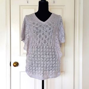 NWT. The Limited Multi Patterned Crochet Top w/sleeve design and bottom elastic.
